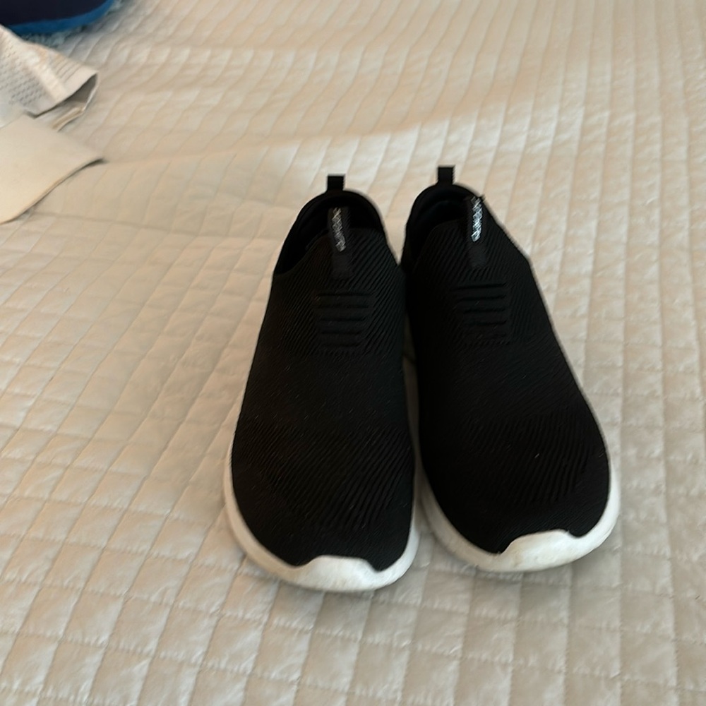 Skechers black slip on sneakers